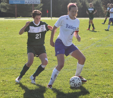 Emily George battles a Stowe defender during Saturday's 1-0 win.